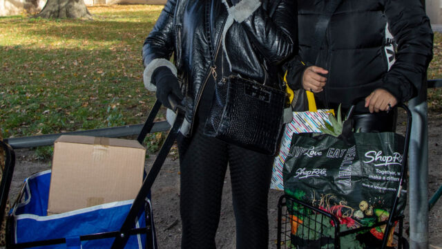 Thanksgiving Food and Turkey Distribution at Breukelen Houses two women with shopping carts