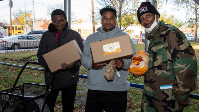 Thanksgiving Food and Turkey Distribution at Breukelen Houses three men