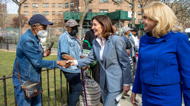 Ribbon Cutting Ceremony for Astoria Houses Floating Hospital Governor Kathy Hochul shakes hands with a woman outdoors