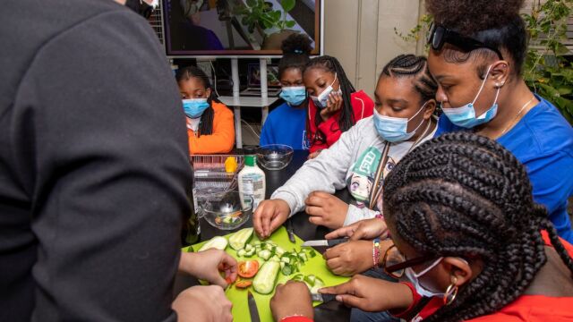 Students prepare some pickles with produce grown from seed to harvest.