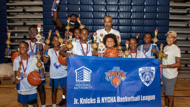 The O'Dwyer Gardens 11-and-under team was joined by former Knick Rod Strickland in celebrating its league championship. O'Dwyer Gardens league champs