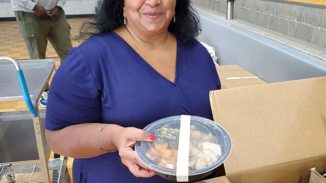 woman holding food container