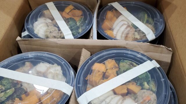 food containers with Thanksgiving meals