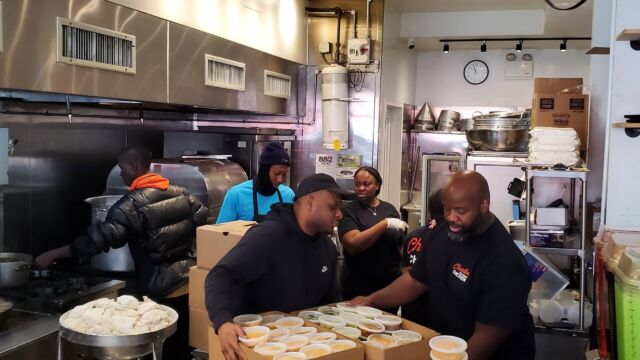 people prepping meals for takeout